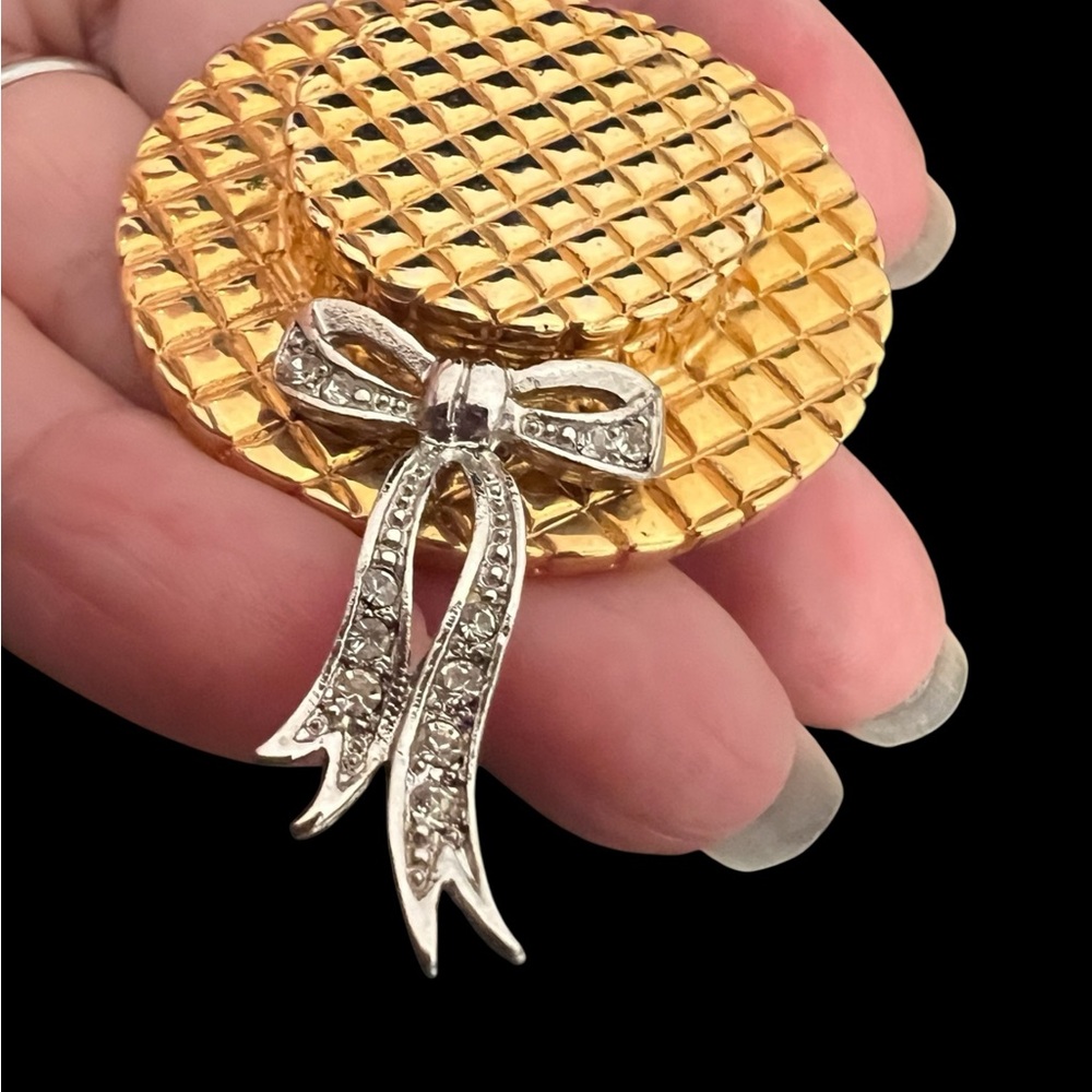 Elegant Gold and Silver hat with a Bow Brooch